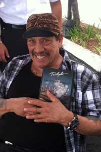 Danny Trejo holding Twilight in the City of Angels